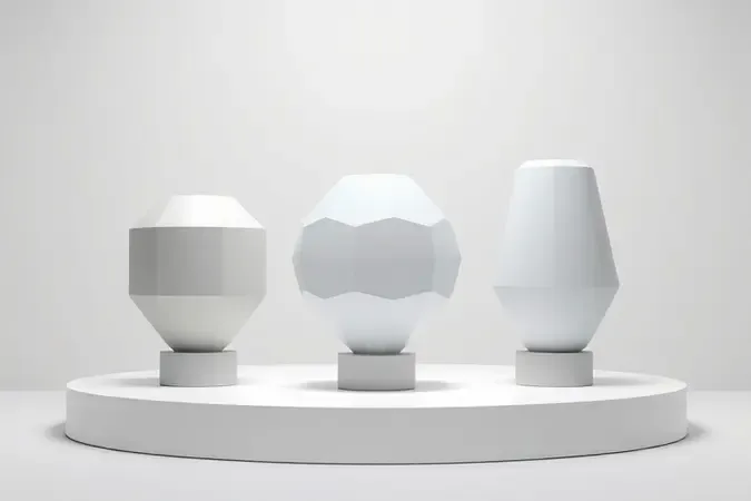 Renderização 3D conceitual com três formas geométricas representando diferentes tipos de pistola de pintura e seus acabamentos.
