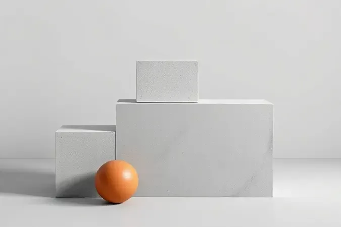 Cubos de concreto em diferentes tons de cinza dispostos em escada minimalista representando comparação de qualidade entre cimentos Intercement.